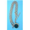 Image 1 : A 9ct gold curblink albert, with 15ct gold mounted hardstone swivel fob seal, gross weight 62.4gr...