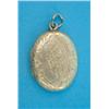 Image 1 : A gold foliate engraved oval pendant locket...