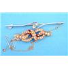 Image 1 : An 18ct tied ribbon brooch, set split pearls, together with a gold crossover bar brooch set with...