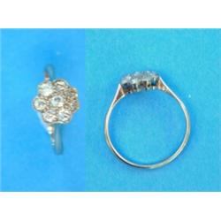An 18ct white gold and platinum diamond set flowerhead cluster ring...