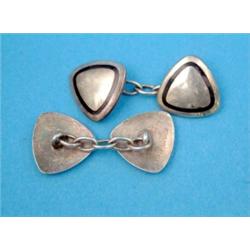 A pair of Sterling silver and black enamel triangular shaped cufflinks, with chain link connectio...