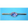 Image 1 : A gold bar brooch, collet set with an oval amethyst...