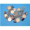 Image 1 : A 9ct gold curblink bracelet, with padlock clasp and 17 various charms including sovereigns, half...