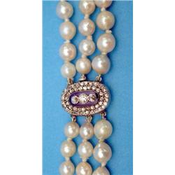 A 3-row graduated cultured baroque pearl necklace, with a Victorian gold, blue enamel diamond set...