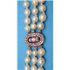 Image 1 : A 3-row graduated cultured baroque pearl necklace, with a Victorian gold, blue enamel diamond set...