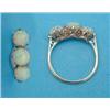 Image 1 : A three stone opal ring, claw set in 18ct gold...