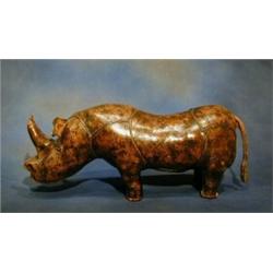 A leather foot stool in the form of a rhinoceros 30" £100-150...