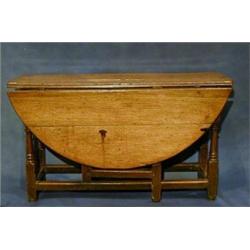 A fine quality 18th Century honey oak, oval, drop flap gateleg dining table (missing drawer) rais...