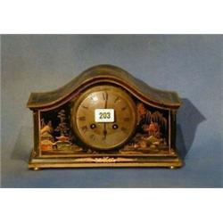 A 1930's 8 day chiming mantel clock with silvered dial and Roman numerals, contained in an arched...