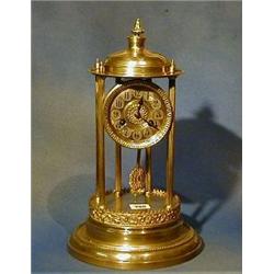 A 19th Century French 8 day striking mantel clock with drum movement and Arabic numerals supporte...