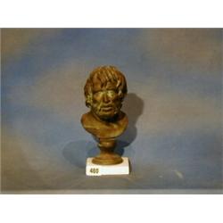 After the antique, a bronze head and shoulders bust of a classical man raised on a marble base (f...