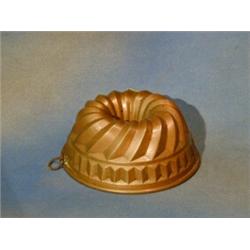 A circular copper jelly mould £50-75...