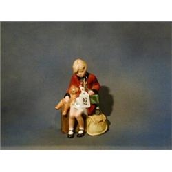 A Royal Doulton figure "Girl Evacuee" HN3203 £200-250...