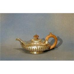 A George III circular silver teapot with demi-reeded decoration London 1821 9 ozs £100-150...