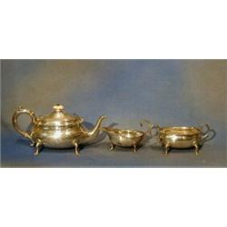 A Victorian 3 piece silver tea service of oval form raised on trifid feet comprising teapot, twin...