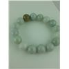 Image 2 : ONE ELASTICISED BRACELET OF PALE GREEN JADE BEADS, 16 BEADS IN TOTAL