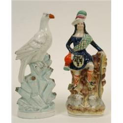 A 19th Century Staffordshire Bird, on a naturalistic base, 29 cm, and a figure of a Highland gent...