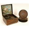 Image 1 : A Nichole Freres Table Top Polyphon, in a walnut case, and twenty one 20.5 cm diameter discs   Se...