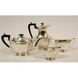 A George V Silver Four Piece Tea Service, comprising, teapot, hot water pot, milk jug and sugar b...
