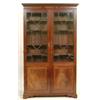 Image 1 : An Early 19th Century Mahogany Bookcase, the greek key cornice above a pair of astragal bar glaze...
