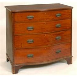 A George III Style Mahogany Serpentine Fronted Chest, by Jas Shoolbred and Co, London, having fou...