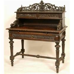 A Late 19th Century Carved Oak Desk, with geometric inlaid decoration, the three quarter gallery...