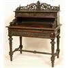 Image 1 : A Late 19th Century Carved Oak Desk, with geometric inlaid decoration, the three quarter gallery...