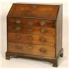 Image 1 : A Georgian Oak Bureau, the fall front revealing a fitted interior above four graduated long drawe...