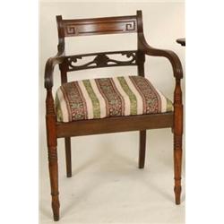 A Pair of Early 19th Century Mahogany Armchairs, with scroll carved back rails, drop in seats, an...