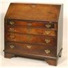 Image 1 : A 19th Century Oak Bureau, the fall front enclosing a stationery compartment, over four graduated...