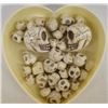 Image 2 : Collection of Skull Beads in Celluloid Heart Box