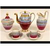 Image 1 : A 19th Century Paris Porcelain Part Coffee Set, painted flowers on a blue ground above a puce low...