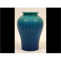 A Royal Lancastrian Vase, of ribbed baluster form, decorated a blue and turquoise glaze, impresse...