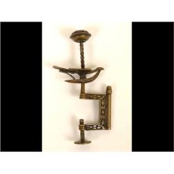 A Victorian Brass Hemming Bird, the needle cushion on a spiral twist column with a bird below  Se...