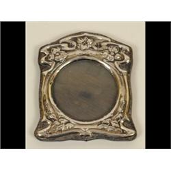 An Art Nouveau Silver Mounted Photo Frame, decorated flowers, 10.5 x 9 cm  See illustration £30-5...