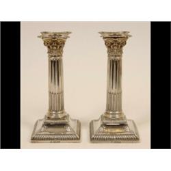 A Pair of Late Victorian Silver Corinthian Column Candlesticks, on stepped square bases, Sheffiel...