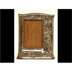 An Edwardian Silver Mounted Photo Frame, decorated a milk maid, animals and foliage, Birmingham 1...