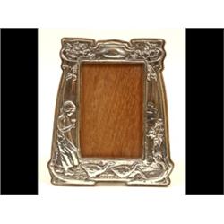 An Art Nouveau Silver Mounted Photo Frame, embossed a Dutch girl, geese and foliage, Birmingham 1...