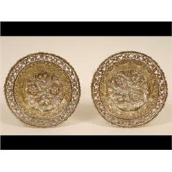 A Pair of Late Victorian Silver Gilt Fruit Bowls, with pierced scrolling foliate borders and embo...