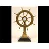 Image 1 : A Ship's Wheel Timepiece, with seconds dial, on a fluted column and stepped square base, 36 cm  S...