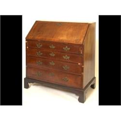 A George III Mahogany Bureau, the fall front revealing a fitted interior, above four graduated lo...