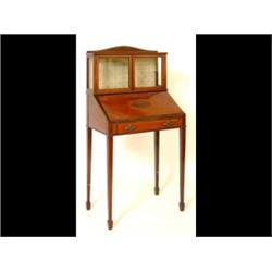 An Edwardian Inlaid Mahogany Bonheur du Jour, the raised superstructure having a pair of glazed d...