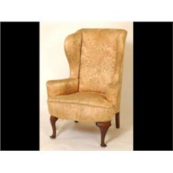 An 18th Century Style Wingback Armchair, on cabriole legs and pad feet  See illustration £200-300...
