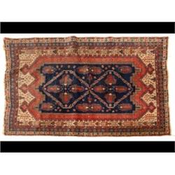 A Kazak Style Rug, the central ground applied two lozenges on a blueground, within a multi border...