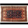 Image 1 : A Kazak Style Rug, the central ground applied two lozenges on a blueground, within a multi border...