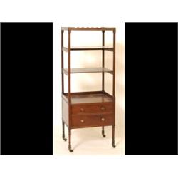 An Early 19th Century Mahogany Four Tier Whatnot, the lower stage having two drawers on tapering...
