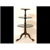 Image 1 : A Mahogany Three Tier Dumb Waiter, the circular tiers on vase turned supports and a tripod base (...