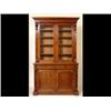 A Victorian Mahogany Bookcase, on cupboard, the moulded cornice above a pair of glazed doors, wit...