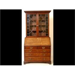 A Mahogany Bureau Bookcase, the rope twist cornice above a pair of astragal bar glazed doors encl...