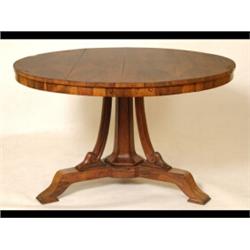 An Early Victorian Rosewood Centre Table, the circular tilt top on a central octagonal column wit...